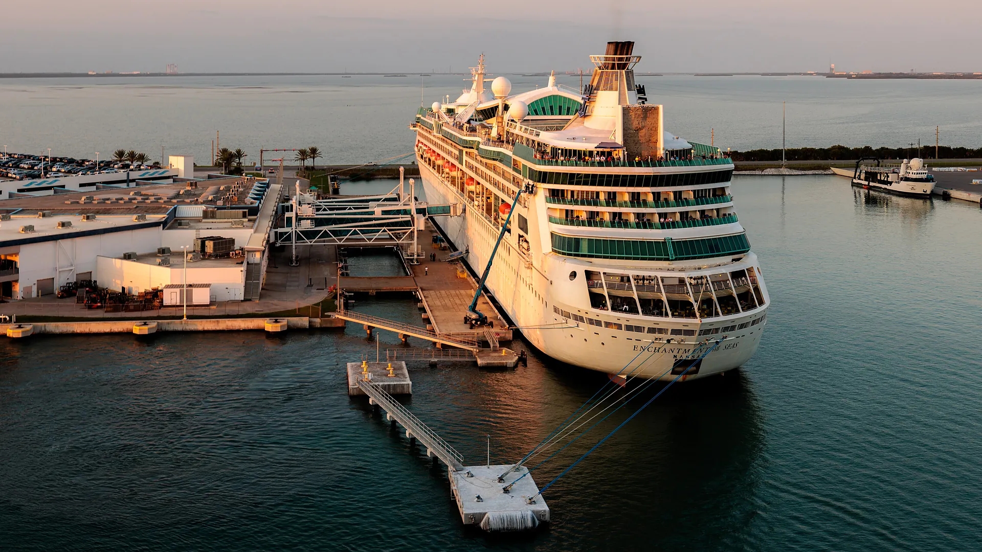 A cruise ship docked at sunset